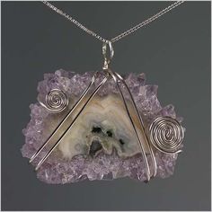 This is nature at its finest! This stunning amethyst stalactite has been delicately wrapped with sterling silver wire and placed on a 16 " sterling silver box chain. The amethyst stalactite measures approximately 1.25 " in height by 1.50 " in width and is a gorgeous statement piece. Other length box chains are available below for an additional cost. Unique Adjustable Sterling Silver Crystal Necklaces, Unique Amethyst Nickel-free Jewelry, Nickel-free Amethyst Jewelry, Handmade Silver Geodes For Jewelry Making, Spiritual Gemstone Jewelry With Silver Plated Wire, Healing Silver Geodes With Natural Stones, Silver Wire Wrapped Jewelry With Mineral Crystal, Sterling Silver Wire Wrapped Pendant Crystal Necklace, Sterling Silver Wire Wrapped Pendant Crystal Necklaces