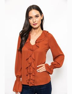 Earn up some serious style points while wearing this Urban Edge Ruffled Blouse on your next day out. Decorated with ruffle trim detailing that traces all the way from the neckline to the hem, this stylish blouse features a V-neckline and long sleeves with elasticated ruffle cuffs. It has a button fastening for closure on the front. *Polyester *Machine wash recommended *Front button fastening for closure *Ruffle trim detailing buttoned cuffs Chic V-neck Blouse With Ruffle Hem, Fall V-neck Top With Ruffle Hem, V-neck Ruffled Blouse For Work, Fall V-neck Ruffled Tops, V-neck Ruffles Blouse For Work, V-neck Ruffle Blouse For Work, Chic Tops With Ruffled Collar For Work, Elegant Ruffle Hem Tops For Work, Spring Workwear Blouse With Ruffle Hem