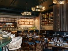 an empty restaurant with many tables and chairs