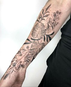 a person with a flower tattoo on their arm