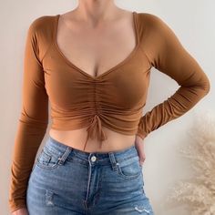 Our Roxy Crop Top Features A Scrunched Adjustable Tie Front. Super Soft And Stretchy Fabric: 92% Polyester 8% Spandex Color: Camel Ruched Stretch Crop Top For Fall, Stretch Ruched Crop Top For Fall, Fall Stretch Ruched Crop Top, Black Sequin Crop Top, Barbie Crop Top, Cream Crop Top, Yellow Crop Top, Sequin Crop Top, Satin Long Sleeve