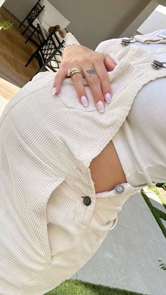 a woman's hand on the back of her skirt