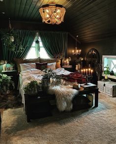 a bed room with a neatly made bed and lots of lights hanging from the ceiling