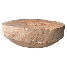 a large wooden bowl sitting on top of a table