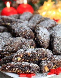 chocolate crinkle cookies on a plate with christmas decorations in the background