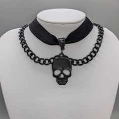 Embrace your Darker Side with this alluring Black Skull Layered Choker. Wear casual or dressy, whatever your heart desires. Add more Skulls to your look and pair with our Skull Rings and Earrings. Embrace the Darker Side! Details: Fashion Jewelry ~ Handmade Diameter: 13 inches + 2 inch extender Skull charm: 35 x 22 mm Gothic Black Choker For Alternative Fashion, Skull Choker Necklace, Punk Black Choker Jewelry, Handmade Black Gothic Choker, Rocker Jewelry, Black Metal Grunge Choker, Ribbon Choker, Dark Jewelry, Layered Chokers