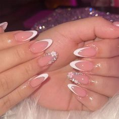 a woman's hands with pink and white nails