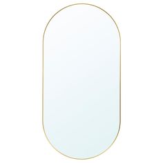 an oval shaped mirror with gold trim on the edges and bottom edge, against a white background