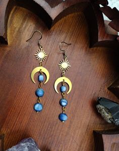 Bohemian Blue Crystal Earrings, Blue Bohemian Crystal Earrings, Bohemian Teardrop Moon Charm Earrings, Bohemian Teardrop Earrings With Moon Charm, Mystical Blue Jewelry For Festivals, Celestial Jewelry For Festivals, Celestial Style Drop Earrings For Festivals, Celestial Style Pierced Jewelry For Festivals, Bohemian Moon Shaped Brass Jewelry