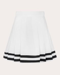 A vision in crisp cotton, the Zinia mini skirt contrasts its white silhouette with navy stripes along the hem. Traditional pleats create preppy, dimensional appeal. Side-zip closure Elasticized back waist Pleated details Contrast trim 100% cotton Dry clean only Made in Peru Size & Fit Fits true to size Size XS: 33.07-34.65in bust, 25.98-27.56in waist, 35.43-37.01in hips Size S: 34.65-36.22in bust, 27.56-29.13in waist, 37.01-38.58in hips Size M: 36.22-37.8in bust, 29.13-30.71in waist, 38.58-40.16in hips Size L: 37.8-39.37in bust, 30.71-32.28in waist, 40.16-41.73in hips Size XL: 39.37-40.94in bust, 32.28-33.86in waist, 41.73-43.31in hips Please note, above measurements reflect De Loreta's size chart, not the actual garment. | De Loreta Women's Zinia Mini Skirt in White/navy Size XS | Cotton Navy Skirt, Navy Stripes, Contrast Trim, White Skirts, Side Zip, Peru, Mini Skirt, Mini Skirts, Stripes