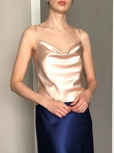 This silk satin top can be worn as a party and date dress and for many other occasions. Made of satin silk.  DESCRİPTİON:  -Adjustable straps.  -Designed for a slim but relaxed fit.  -Unlined. İt is a custom made top tailored according to your preferences. While ordering write your bust and waist measure, so the top will be made to your size. Please enquire if you're interested in different color. SIZING INFO: XS/34/US4: bust: 82-86cm (32-33 inch) waist 64-66 cm (24-25 inch)  S/36/ US6: bust: 86-88cm (33-34 inch) waist: 66-68 cm (25-26 inch) M/38/ US8: bust: 88-92 cm (34-36 inch) waist: 68-72 cm (26-28 inch) L/40/ US10:  bust: 92-94 cm (36-37 inch) waist: 72-74 cm (28-29 inch) WASH and CARE: Hand wash. Iron at high heat. Don't hesitate to contact me with any question or thought, I'd love t Elegant Backless Tank Top With Built-in Bra, Summer Party Camisole With Built-in Bra, Satin Camisole For Date Night, Satin Camisole Top For Date Night, Fitted Sleeveless Satin Tank Top, Fitted Satin Finish Sleeveless Tank Top, Satin Cami Top For Date Night, Elegant Backless Tank Top For Summer, Cami Top With Built-in Bra For Evening