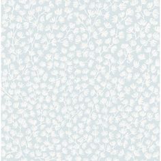 a light blue and white wallpaper with small leaves on the bottom half of it