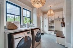 an image of a laundry room with washer and dryer