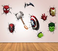 the avengers wall decals have been made to look like they are coming out of the wall