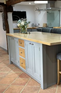 a large kitchen island with two stools next to it