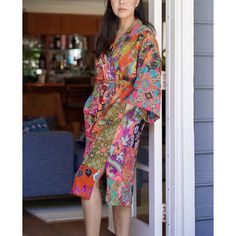 This is a washable printed batik robe/ kimono handmade by artisans. Two side pockets. Removable waist tie closure. Belt loops and inside ties to secure closure. Side slits at hem. Machine washable in cold and machine dry in delicate setting. This is made of printed batik fabric and not wax and dye batik fabric. The kimono robe is made of patchwork quilted batik printed fabric and it is thick. Bungalow Rose | Bungalow Rose Varian 100% Cotton Quilt Mid-Calf Bathrobe w / Pockets Patchwork Quilted 4 Traditional Summer Batik Print Kimono, Bohemian Robe With Relaxed Fit And Kimono Sleeves, Multicolor Bohemian Kimono For Home, Summer Home Kimono In Multicolor, Multicolor Summer Kimono For Home, Summer Multicolor Kimono For Home, Multicolor Summer Robe For Home Use, Summer Multicolor Kimono, Spring Kimono With Relaxed Fit