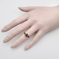 This is part of Chairish’s Fine Jewelry assortment.  A lovely Victorian ring with classic motifs that are feminine and delicate. This 14k gold band mirrors itself and meets at the centre in a cluster of gemstones—a milky white seed pearl flanked by two rubies. The gemstones are prong set, with the pearls housed in geometric squares that offset the femininity of the piece. The rubies are natural, which can be seen in the slight inclusions of the stones. They are very vibrant, and the craftsmanshi Elegant Multi-stone Open Birthstone Ring, Elegant Multi-stone Diamond Ring Gift, Elegant Multi-stone Diamond Ring As Gift, Elegant Multi-stone Ruby Open Ring, Elegant Multi-stone Open Ruby Ring, Elegant Multi-stone Cluster Open Ring, Elegant Multi-stone Open Cluster Ring, Elegant Multi-stone Cluster Promise Ring, Elegant Multi-stone Birthstone Ring For Anniversary