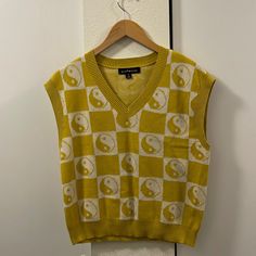 Yellow Knit Vest With Yin Yang Pattern. Never Worn, Brand New Condition. Casual Yellow Sweater Vest For Fall, Casual Yellow V-neck Sweater, Yellow Knitted V-neck Top, Casual Yellow Sweater Vest For Winter, Yellow Knitted Crew Neck Top, Yellow Retro Knit Top, Yellow Cotton Knitted Sweater, Yellow Knitted Cotton Top, Casual Yellow Cotton Sweater Vest