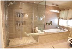 a bath room with a sink and a bath tub next to a shower head mounted on the wall