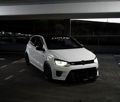 a white car parked in a parking lot