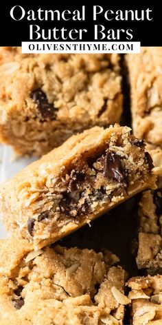 oatmeal peanut butter bars stacked on top of each other with chocolate chips