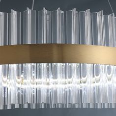 a modern chandelier with clear glass tubes hanging from it's center circle