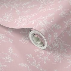 a pink wallpaper with white flowers on it