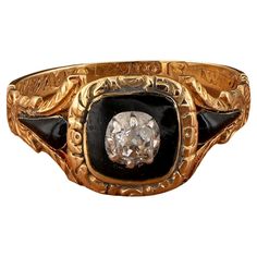 An antique Georgian period Diamond and Black enamel mourning ring in 18 Kt yellow gold, set with an old cut Diamond in a border of black enamel, the engraved shoulders decorated with further enamels With a glass covered locket compartment on the reverse 1 old mine cut diamond of approx .20 Ct Band inscribed 'Thomas Cook OB 13 oct 1824 AET 34', full British hallmarks for London 1824 Wonderful general condition Cannot be altered in size Unless otherwise stated boxes are for presentation only Furth Black Enamel Ring, Enamel Locket, Georgian Jewelry, Cluster Ring, Black Enamel, Signet Ring, Locket, Georgia, Onyx