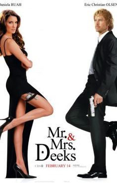 a man in a suit and woman in a dress posing for the poster of mr & mrs cullen