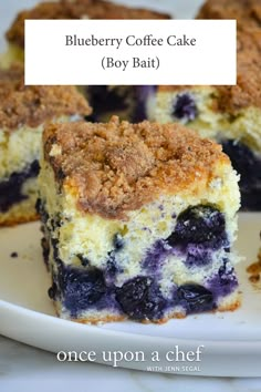 blueberry coffee cake on a white plate with the words, blueberry coffee cake boy bah