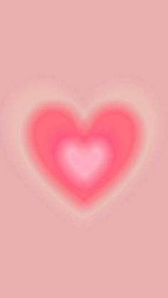 a heart shaped object on a pink background