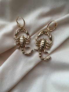 Scorpio season is upon us and these earrings are the perfect accessory!  Height: 2 inches  Width: 2 inches  Made of zinc alloy. Scorpio Earrings, Scorpio Accessories, Scorpio Aesthetic Outfit, Scorpion Aesthetic, Scorpion Jewelry, Scorpio Jewelry, Afro Jewelry, Ocean Inspired Jewelry, Dope Jewelry Accessories