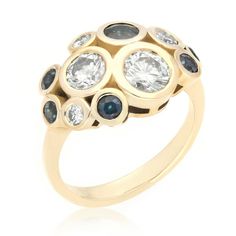 a gold ring with blue and white stones