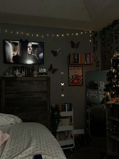 a bedroom decorated for christmas with butterflies on the wall and lights strung from the ceiling