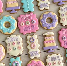 decorated cookies with donuts, donuts grow up and donuts grow up written on them