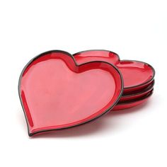 red heart shaped plates stacked on top of each other