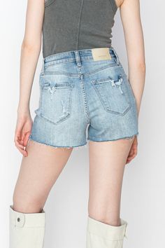 Details Style No. AT2046SHL High-rise stretch denim shorts are a stylish and versatile wardrobe staple. Designed to sit comfortably at or above the natural waistline, they offer a flattering silhouette and ample coverage. Crafted from denim fabric with added stretch, these shorts provide flexibility and ease of movement, making them ideal for all-day wear. Highlights Stretch Denim Fabric Light Stone Wash Front Cut Seam Detail With Distressed Front Rise : 10 1/2" Inseam : 3" Model size : Medium High Rise Stretch Jean Shorts In Light Wash, High Rise Light Wash Stretch Shorts, Light Wash Stretch Shorts With Frayed Hem, High Rise Stretch Light Wash Shorts, Stretch Light Wash Shorts With Frayed Hem, Fitted Shorts With Frayed Hem, Light Wash Stretch High Rise Shorts, Stretch High Rise Denim Bermuda Shorts, Light Wash Stretch Cutoff Jean Shorts