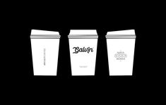 three coffee cups are shown in black and white, with the same logo on them