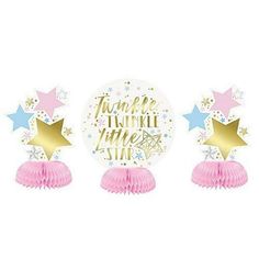 three pink tasselle decorations with stars and the words time to sparkle on them