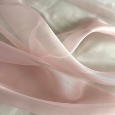 Blush Pink Crystal Organza Fabric by the yard, bulk or wholesale.  Delicately sheer, lightweight, and incredibly soft to the touch, it's the ideal choice for a wide range of projects. Our Dusty Rose Organza fabric is perfect for creating exquisite garments and decorations.  Crafted from 100% polyester, this lightweight fabric offers a sheer and crisp drape, providing strength and elegance in every project. Whether you're designing ball gowns, wedding dresses, blouses, scarves, bridal apparel or fabric roses, organza is the ideal choice for achieving voluminous and structural effects. This pale pink organza fabric is also perfect for event decorations. Whether it's baby shower decor or wedding decorations, the sheer beauty of this organza fabric adds a captivating touch to any setting.  Pro Wedding Table Overlays, Wedding Draping, Deco Rose, Event Planning Tips, Pink Sheer, Blush Pink Weddings, Transparent Bag, Organza Fabric, Wedding Event Planning