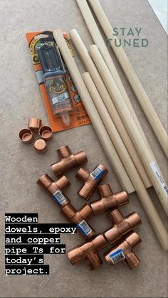 some wood dowels and copper colored pipes for project