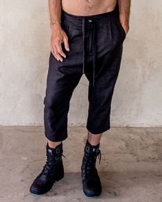 The IDIS Unisex linen pants in Black. Our pants are constructed from a medium weight Linen, with big side pockets, zipped back pockets. button Fly and drawstring waist. slight drop crutch for the extra casual feels. Model wearing size Medium. Designer clothing that moves and evolves with you. Bringing you comfort and movability while maintaining a simple style. SIZE GUIDE XS: bust 88-94 cm | waist 66-72 cm | hips 78-82 cm S: bust 94-100 cm | waist 72-76 cm | hips 82-88 cm M: bust 100-106 cm | wa Black Linen Bottoms For Summer, Black Linen Summer Bottoms, Black Relaxed Fit Capri Pants, Black Linen Harem Pants For Spring, Black Relaxed Fit Capris For Summer, Summer Baggy Capri Length Pants, Casual Straight Linen Capris, Casual Linen Straight Capris, Black Linen Harem Pants For Summer