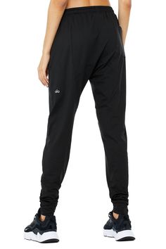 Next-level comfort meets street-smart design. The Revitalize Pant is made from our super-soft Alosoft performance fabric and has an extreme drop rise, on-trend tapered silhouette, pocket at back, elevated seaming and side-zip pockets. Zip pockets Moisture-wicking technology For working out and wearing out Elastic waistband with drawcords Wear-tested by our in-house team for the perfect fit Alo Yoga® | Revitalize Pants in Black, Size: Large Street Smart, Tank Top Bras, Womens Capris, Back Women, Smart Design, Alo Yoga, Performance Fabric, Bra Women, Bra Tops