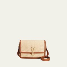 Saint Laurent shoulder bag in raffia, nylon, and calf leather Features signature YSL monogram  Adjustable crossbody strap Can be worn as a shoulder or crossbody bag  Flap top with magnetic closure  Exterior, one slip pocket under flap Interior, one card slot  Approx. 6"H x 9"W x 2.4"D Made in Italy