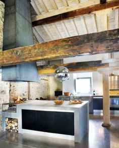 a kitchen with an oven, stove and counter top in the middle of the room