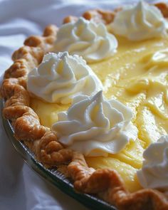 a lemon pie with whipped cream on top