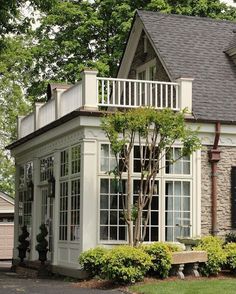 a house with white trim and large windows