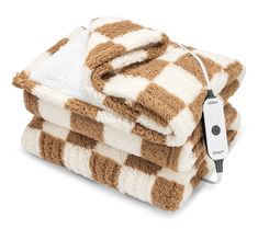 two brown and white checkered towels with an electric cord plugged into the blanket