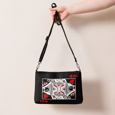 Red Queen Crossbody bag | Poker Purse | Casino Purse | Las Vegas Purse | Wear to Casino | Blackjack Purse Keep your style on point and your hands free with our versatile crossbody bag. It's made of premium faux leather and features dark gray hardware. Thanks to the zip-top closure and multiple inside pockets, you can keep your essentials secure and organized. Transform this crossbody bag with removable wrist and shoulder straps to style it for day-to-night looks. * Outer fabric: faux leather  * Red Queen, Blackjack, Night Looks, Crossbody Purse, Zip Top, Hands Free, Purses Crossbody, Inside Pocket, Shoulder Straps