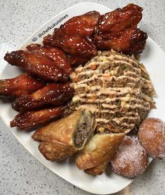 a white plate topped with different types of food on top of a marble countertop